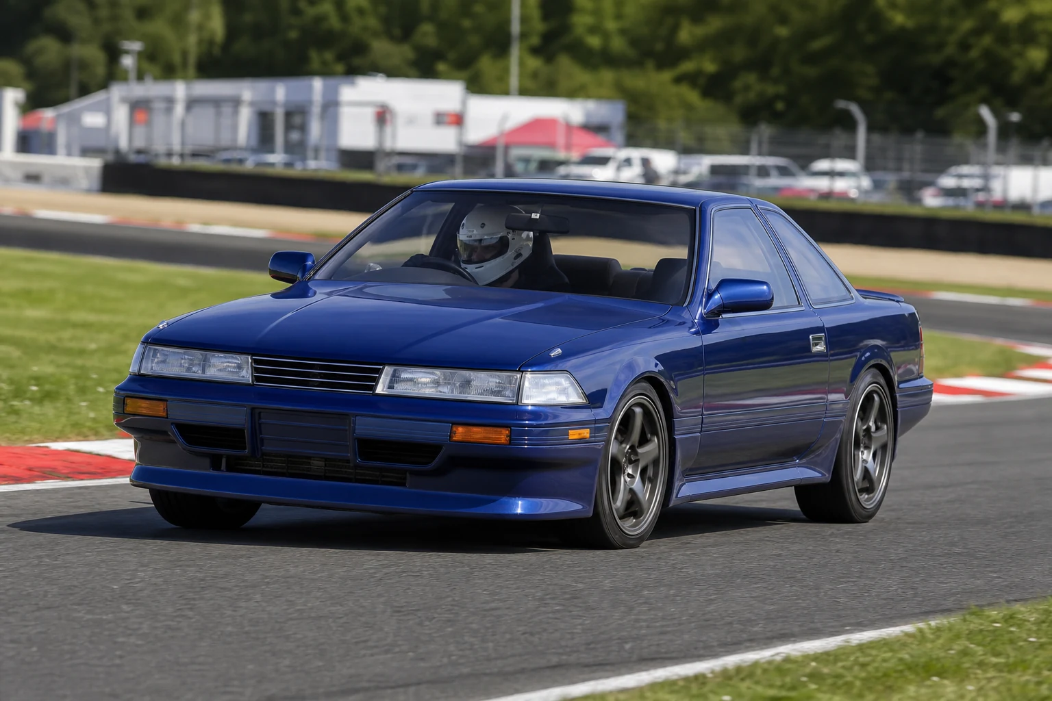 Toyota Soarer on track with a helmeted driver
