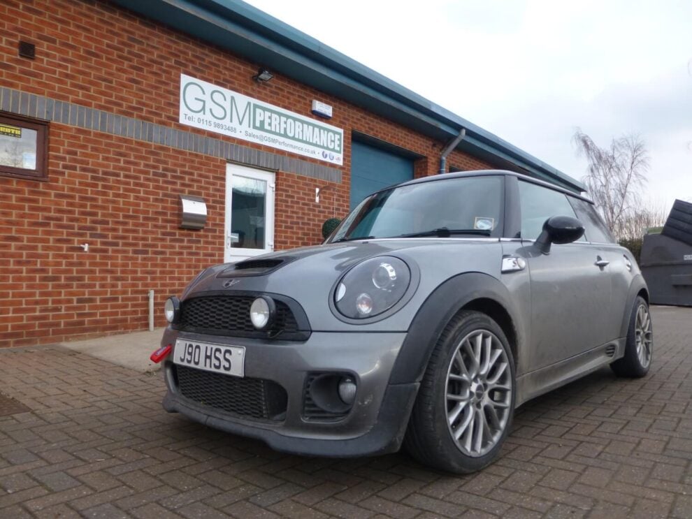 A grey Mini Cooper S parked outside the red brick GSM Performance unit