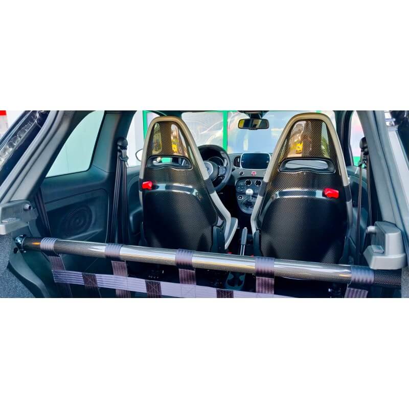 View from the boot of an Abarth with a carbon strut bar and webbing net behind two carbon-backed front seats