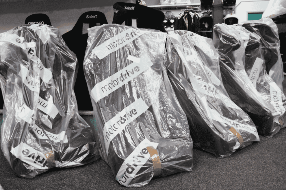 Motordrive seats still in their branded bags on delivery day at the SportSeats4u showroom
