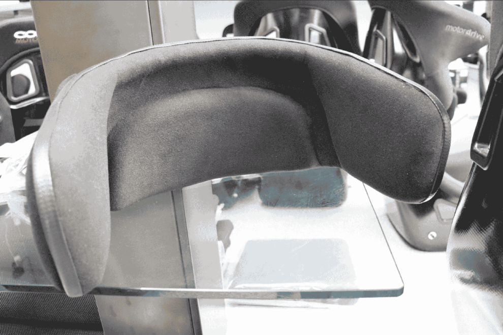 Close up of the padded bolt-on head support fitted to a Motordrive Pro seat