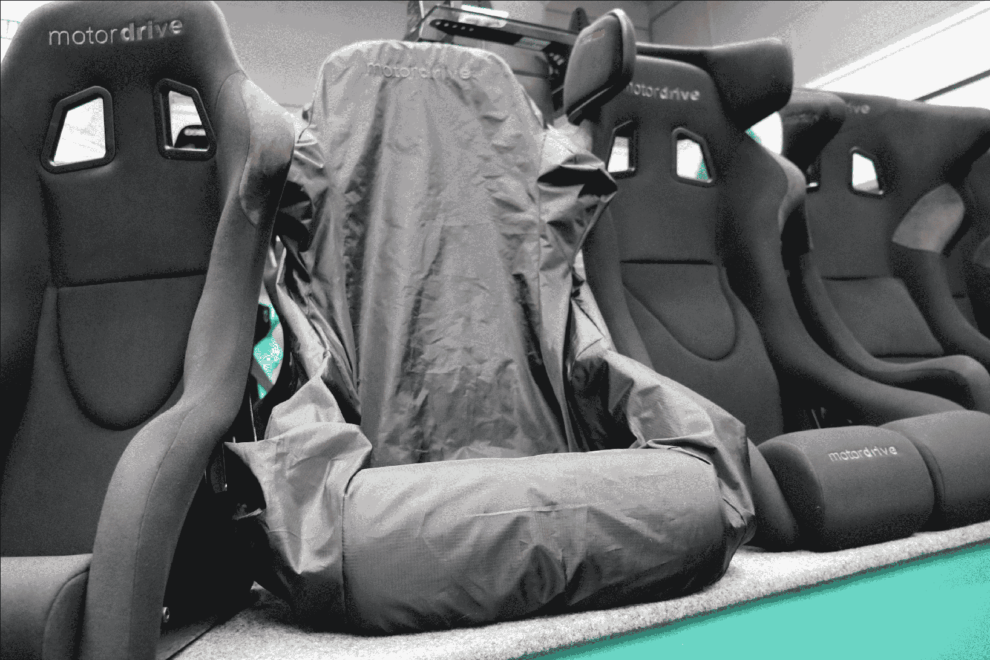 Motordrive bucket seats on the showroom display with one under a fitted Motordrive seat cover
