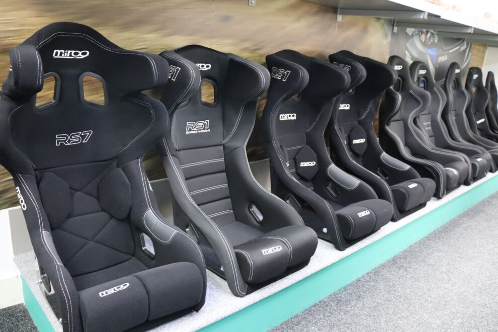 Row of Mirco bucket seats on the FIA display shelf in the SportSeats4u showroom, including the RS7 and RS1