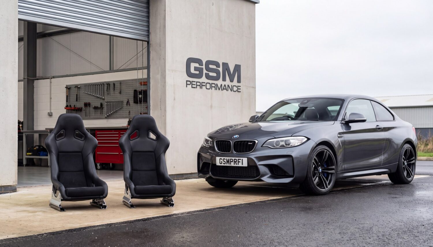 BMW M2 F87 outside the GSM Performance workshop with a pair of bucket seats set up for the Clubsport look