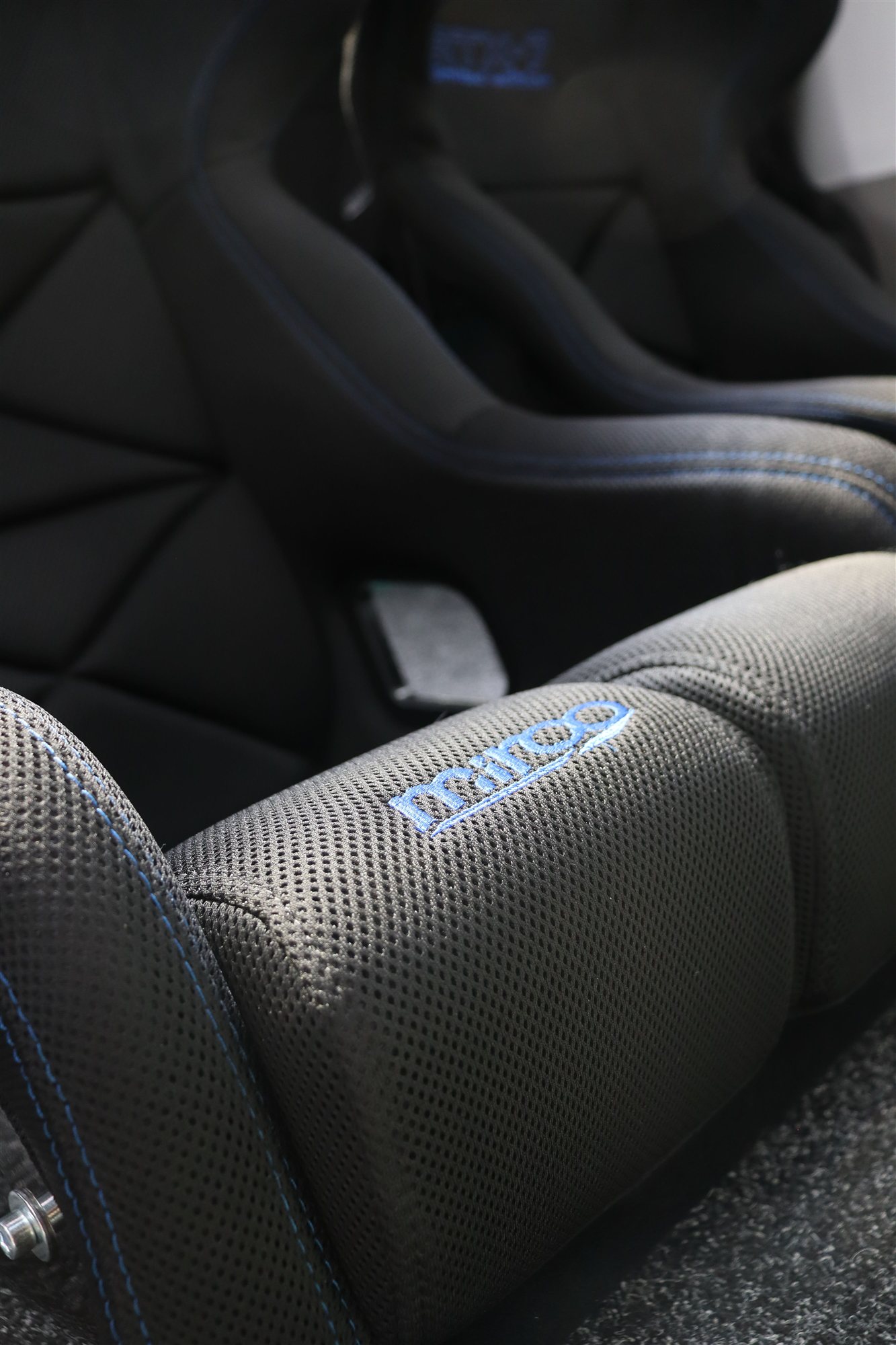 Blue stitching detail on the bolster of a Mirco RTX-7 Limited Edition seat