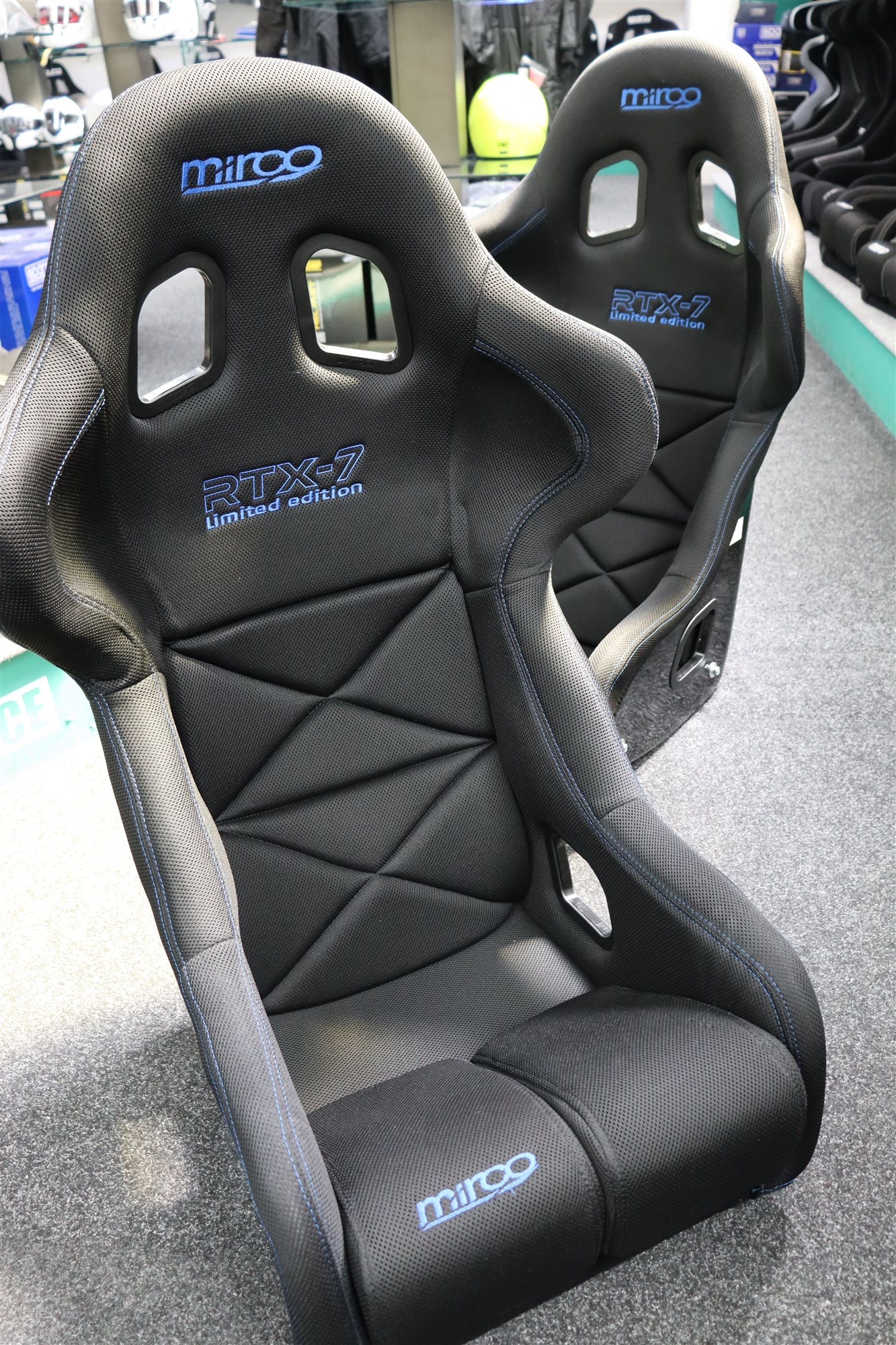 Front view of a Mirco RTX-7 Limited Edition blue stitch FIA bucket seat