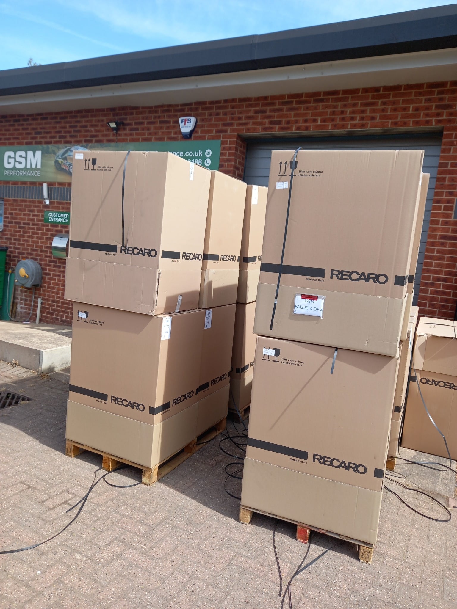 The boxes stacked outside the unit, two pallets deep at GSM Performance