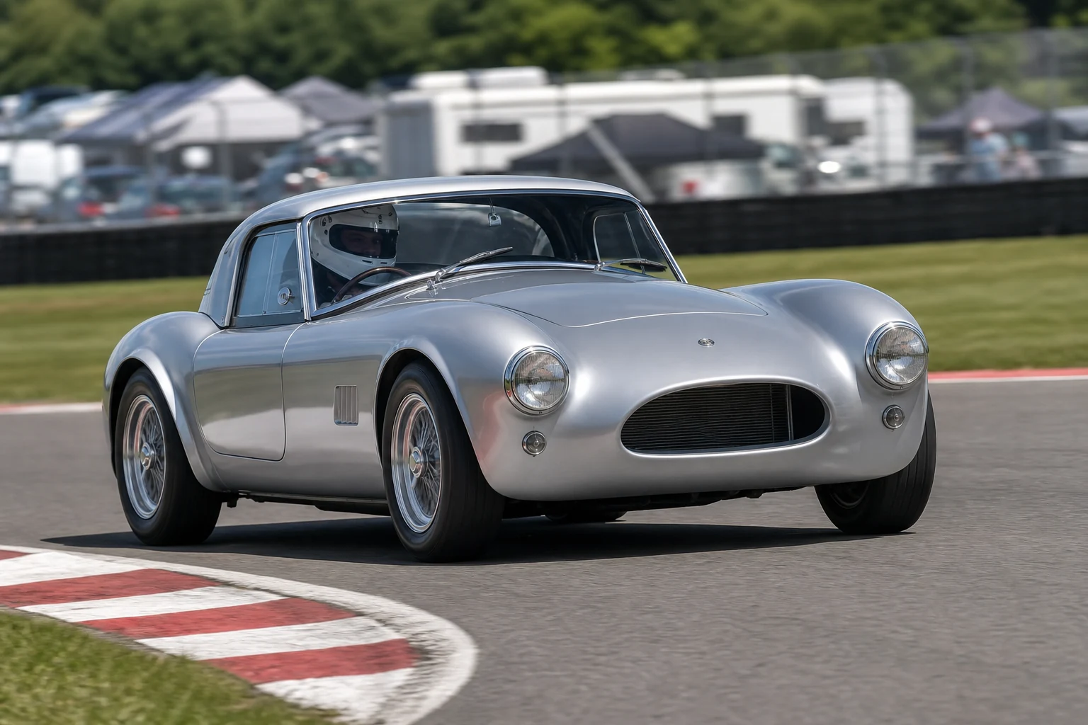AK Cobra Gen 2 on track with a helmeted driver