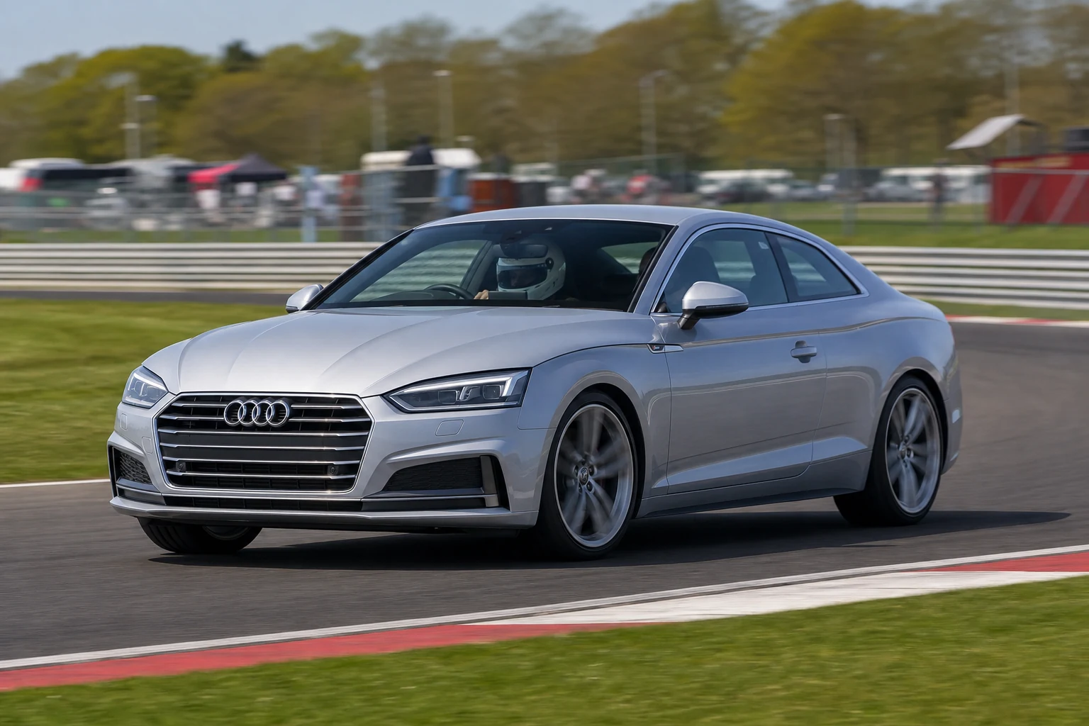 Audi A5 8W6 2nd Gen on track with a helmeted driver