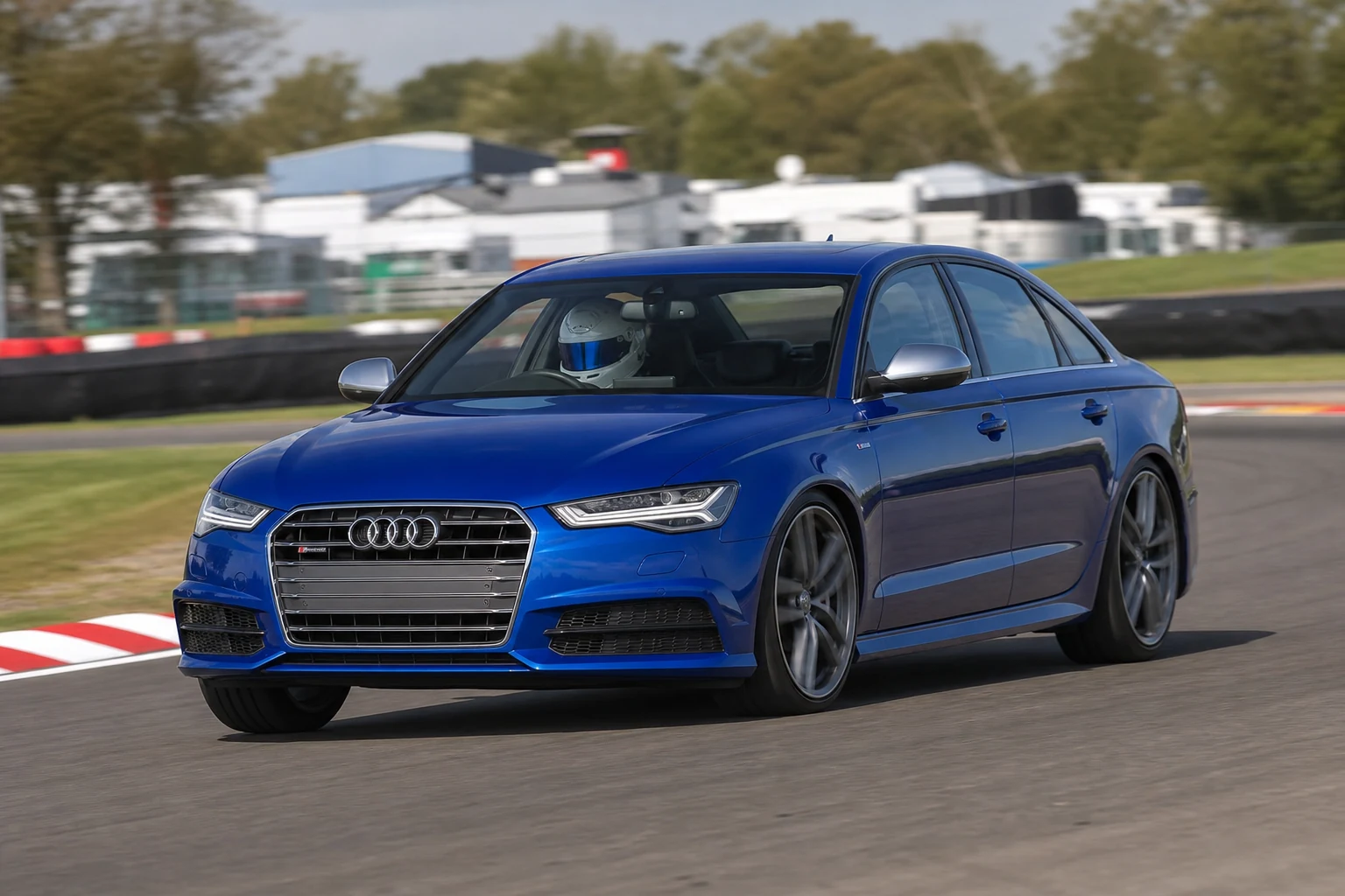Audi A6 / S6 C7 on track with a helmeted driver