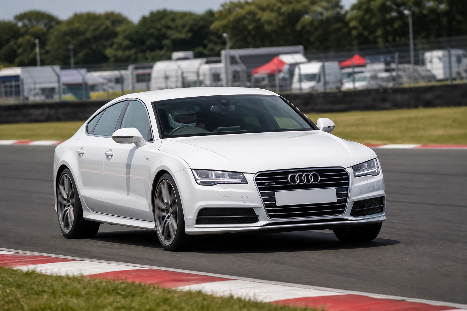 Audi A7 4G8 on track with a helmeted driver