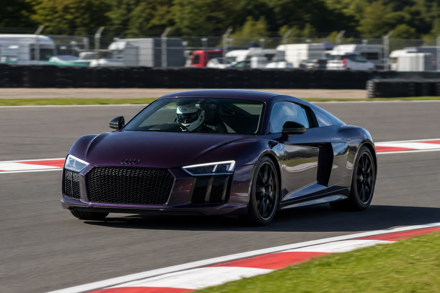 Audi R8 Type 4S on track with a helmeted driver