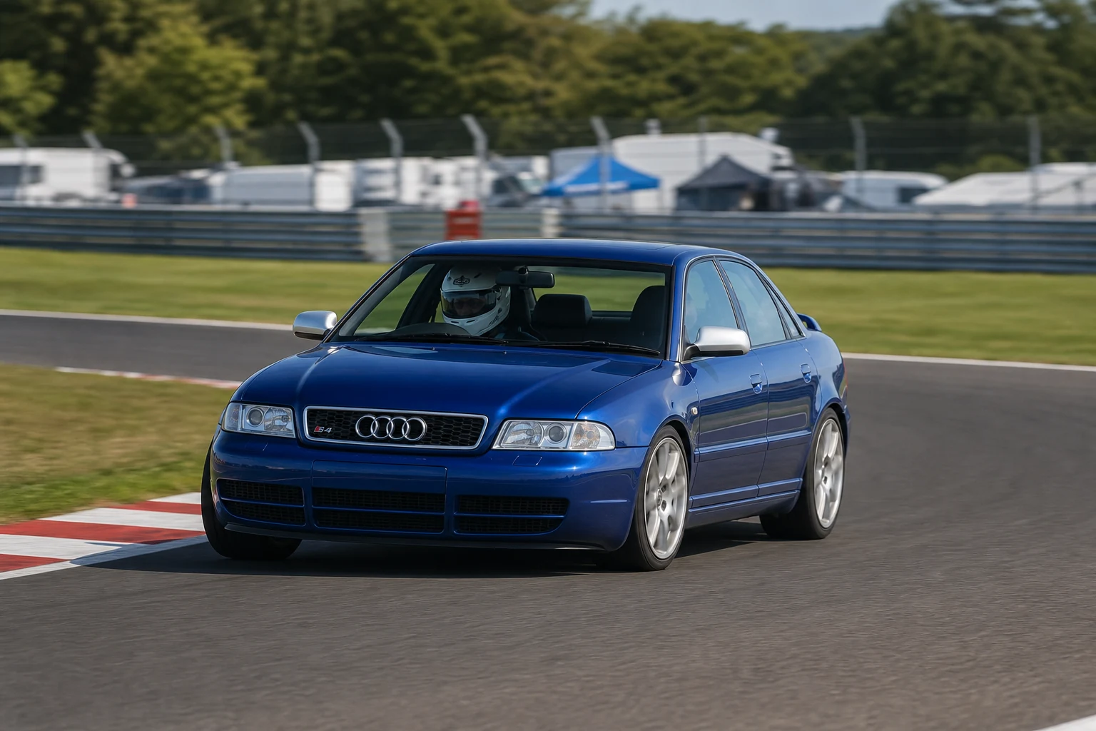 Audi S4 B5 on track with a helmeted driver