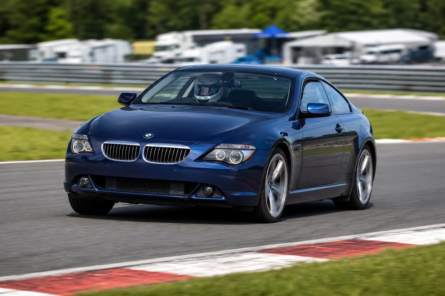 BMW 6 Series E63 on track with a helmeted driver