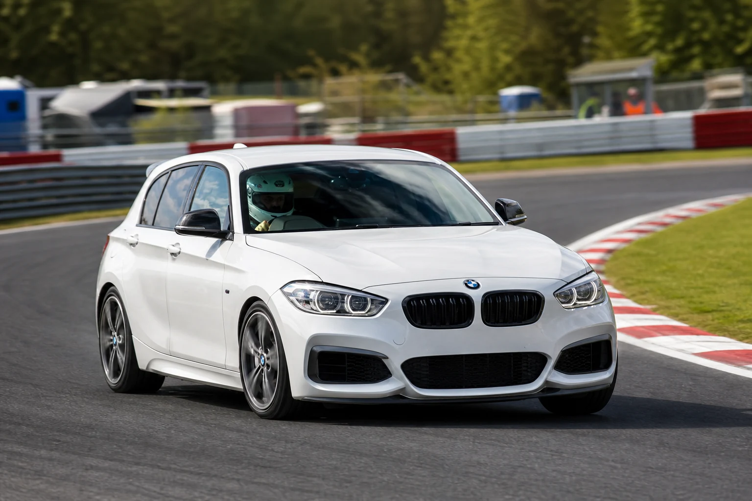 BMW BMW F20/F21 Including M135i M340 on track with a helmeted driver