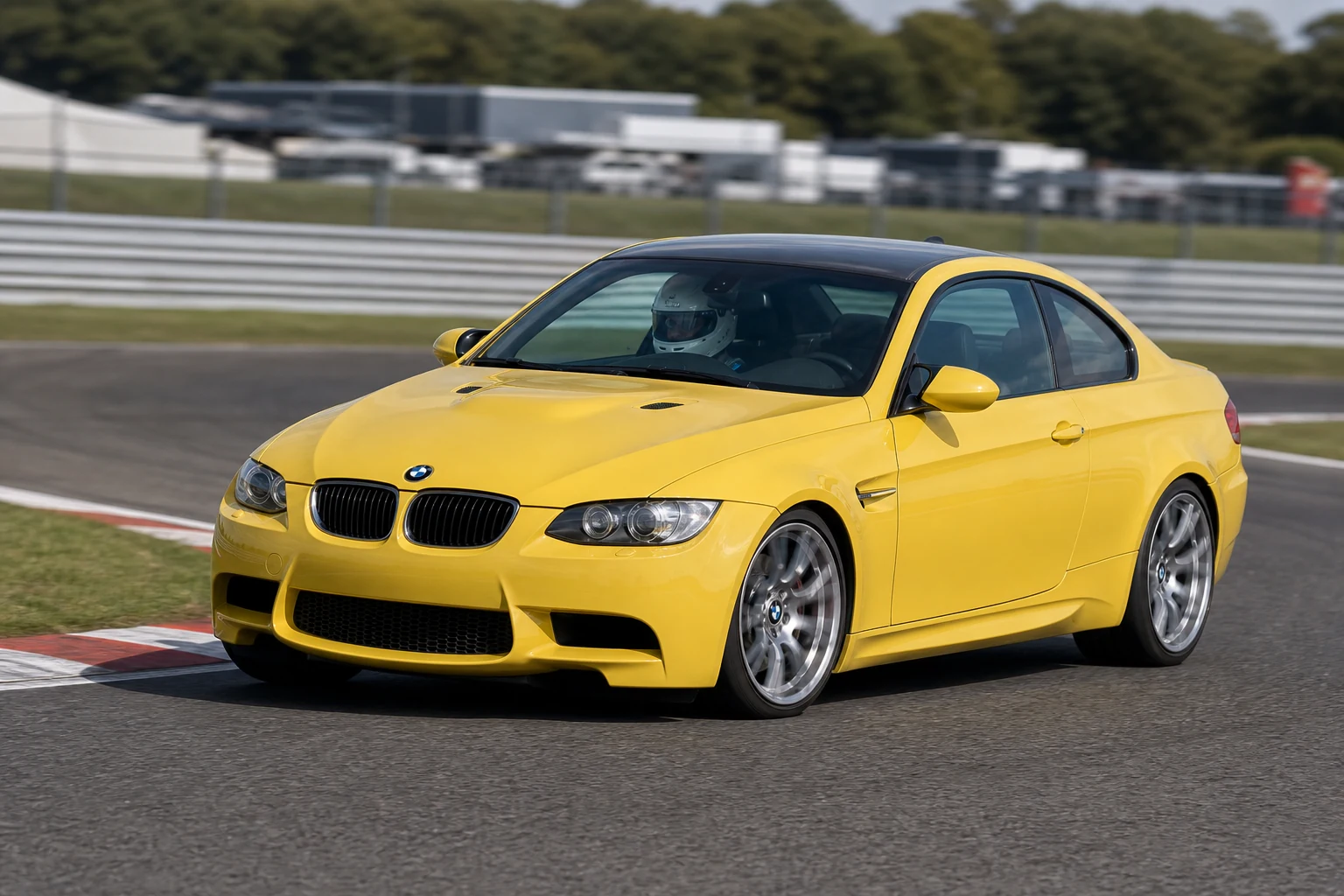 BMW E92 on track with a helmeted driver