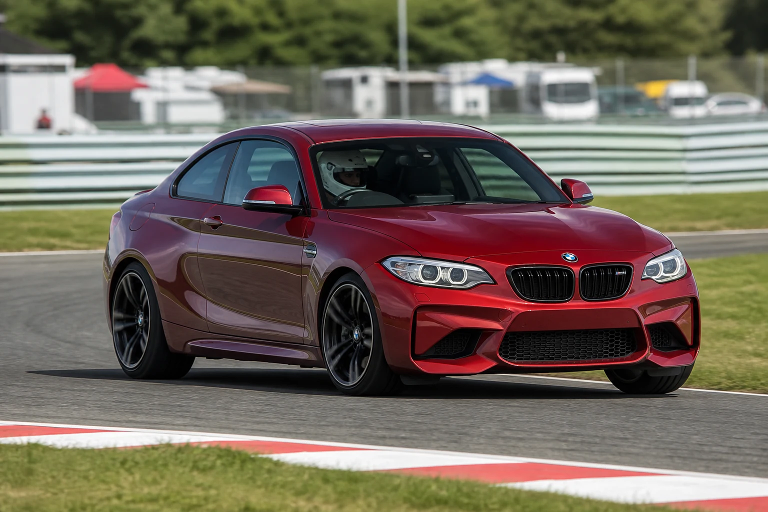 BMW M2 (F22) on track with a helmeted driver