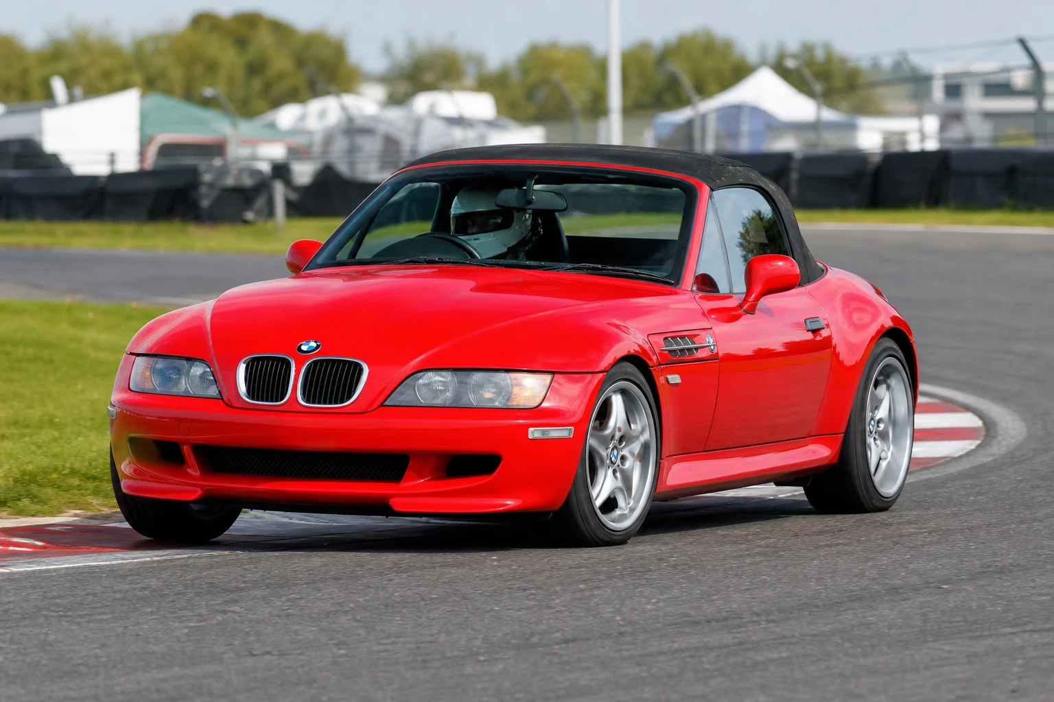 BMW Z3 on track with a helmeted driver
