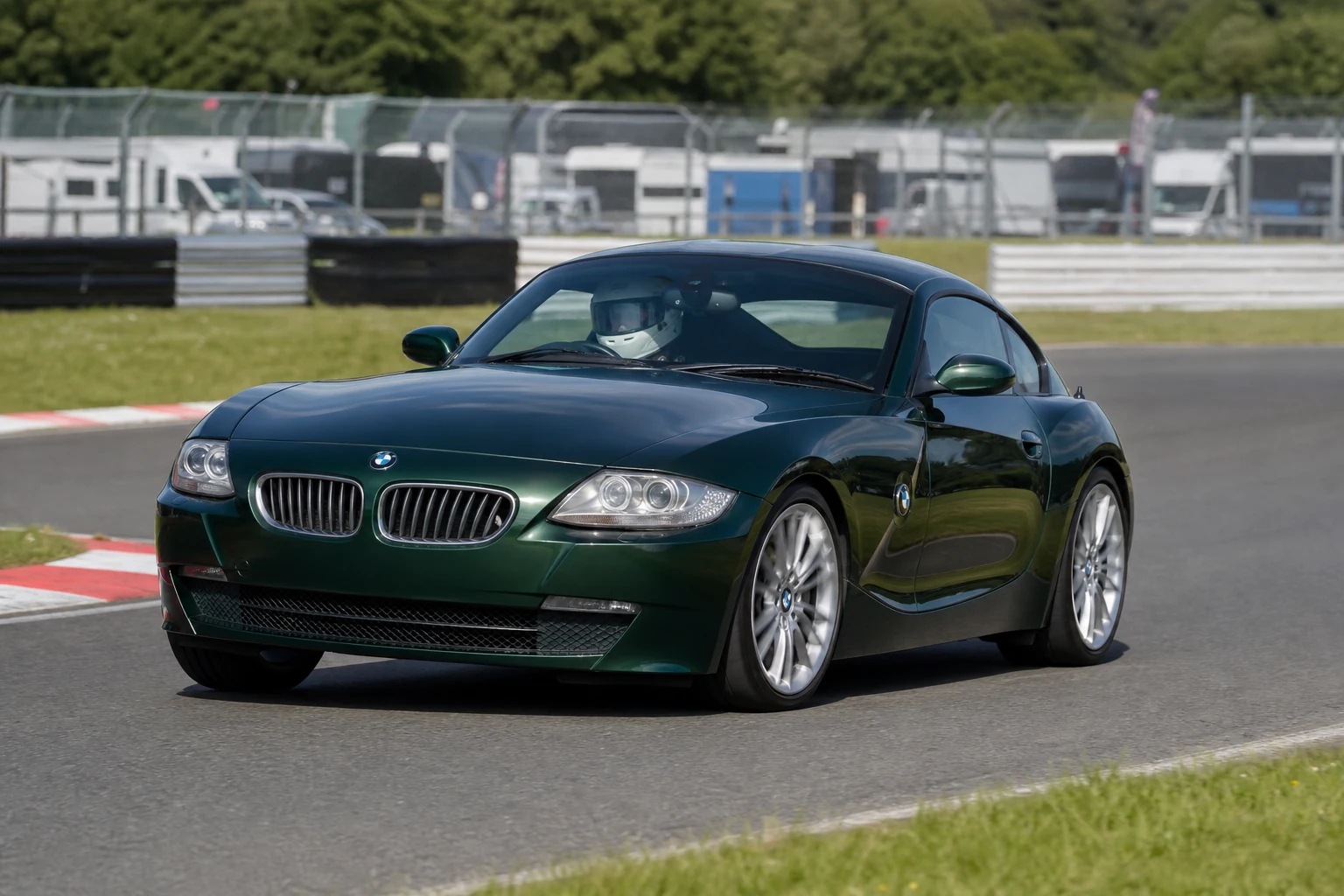 BMW Z4 E85/E86 on track with a helmeted driver