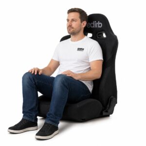 Person seated in Bride edirb 032 ULTRA SUEDE Reclining Sports Seat (part E32NSP) showing real-world seat size and fit – GSM Performance