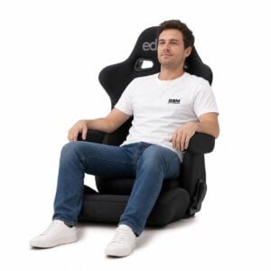 Person seated in Bride edirb 054 ULTRA SUEDE Reclining Sports Seat (part E54NSP) showing real-world seat size and fit – GSM Performance