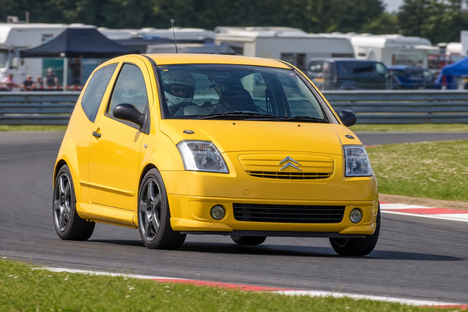 Citroen C2 on track with a helmeted driver