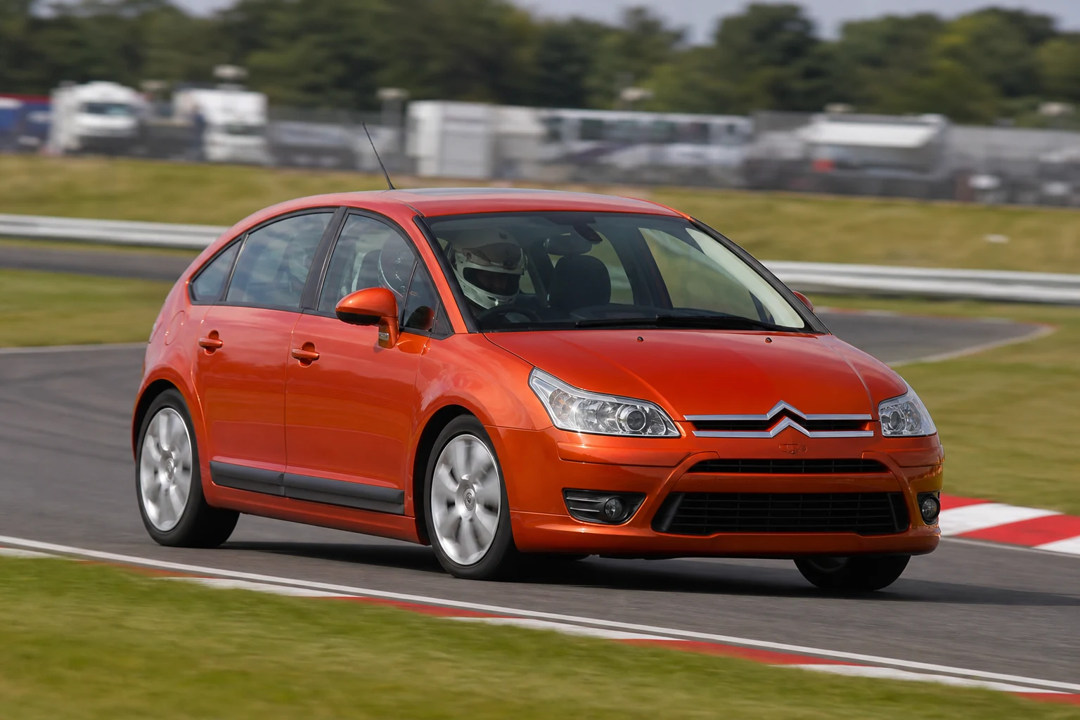 Citroen C4 on track with a helmeted driver