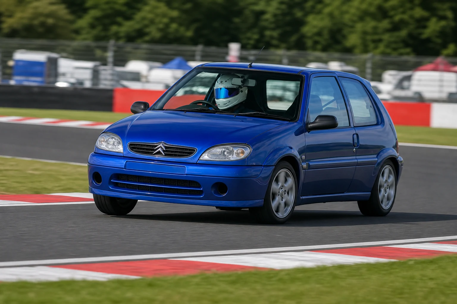 Citroen Saxo on track with a helmeted driver