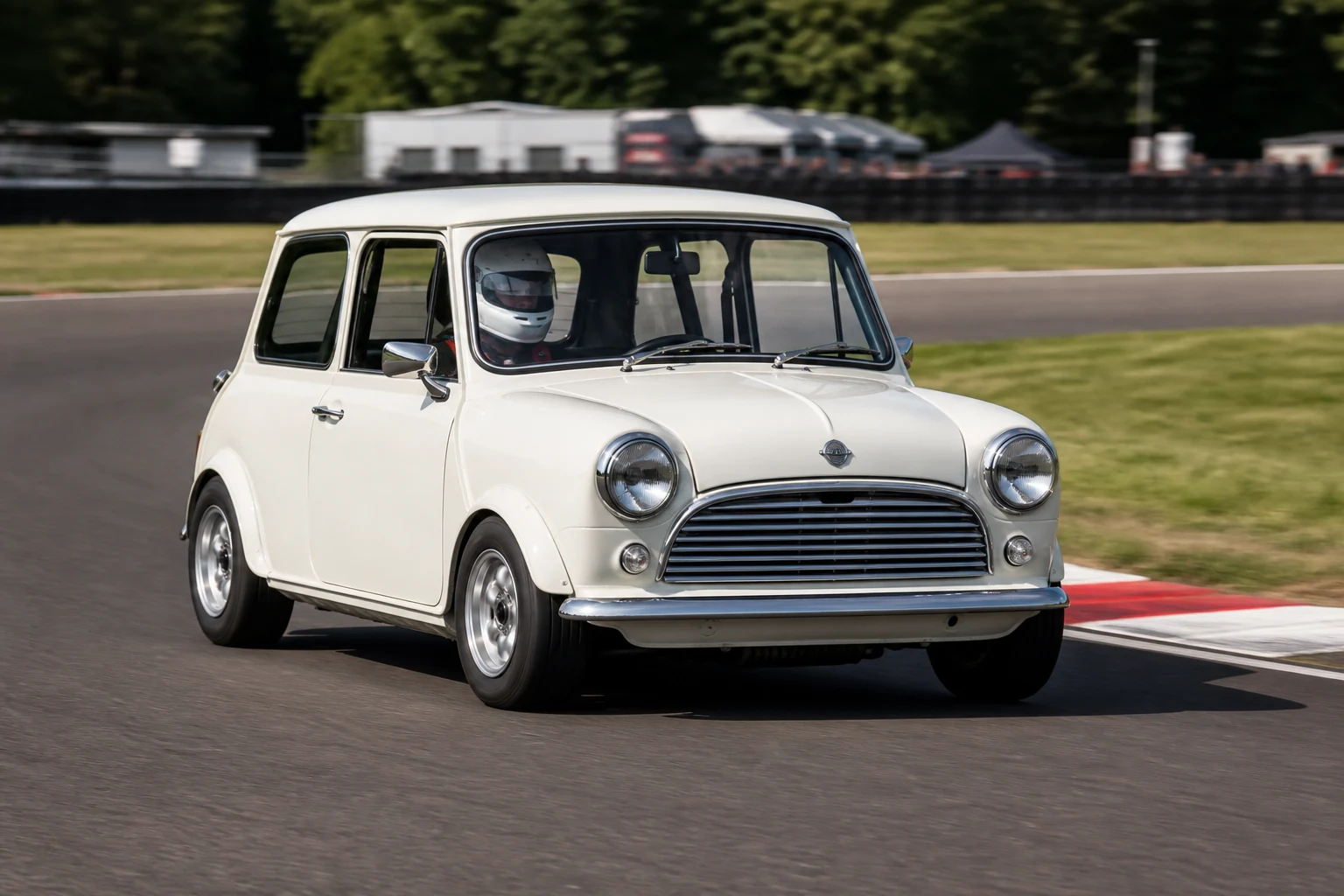Classic Mini on track with a helmeted driver