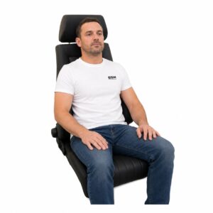 Person seated in Cobra Le Mans Heritage Reclining Office Seat (part LMS-HERT-V-1) showing real-world seat size and fit – GSM Performance