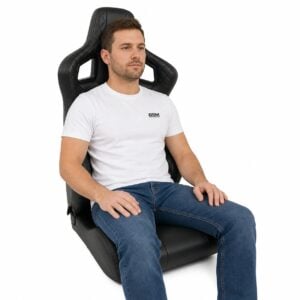 Person seated in Corbeau Sportline RRS Limited Edition Reclining Sport Seat (part RRS-Limited-Edition) showing real-world seat size and fit – GSM Performance