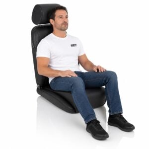 Person seated in Corbeau Sportsman Reclining Sport Seat (part Sportsman) showing real-world seat size and fit – GSM Performance