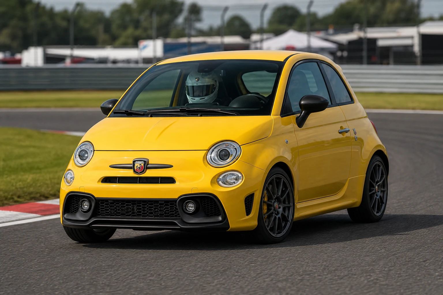 Fiat 595 Abarth on track with a helmeted driver