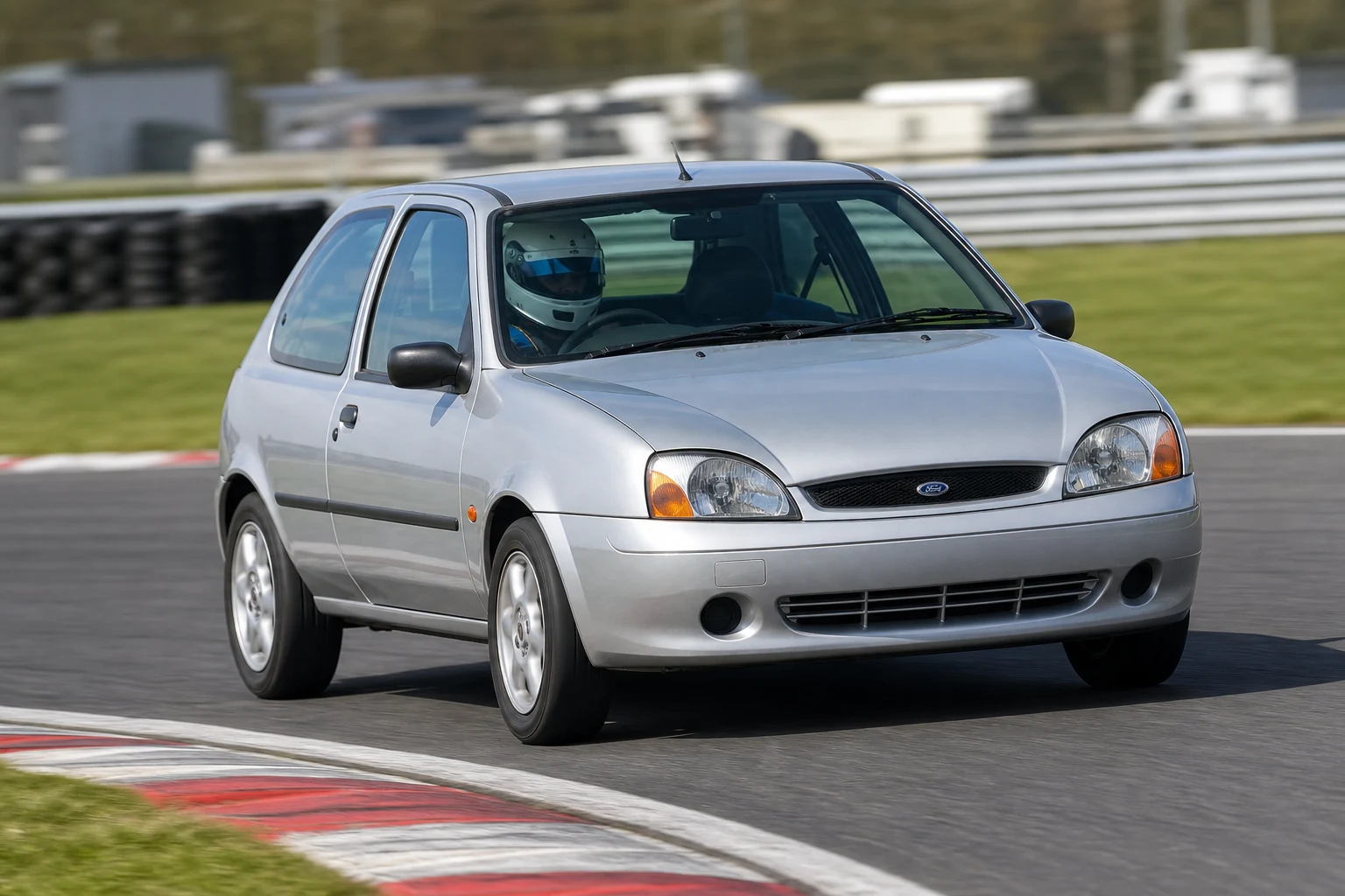 Ford Fiesta MK4 on track with a helmeted driver
