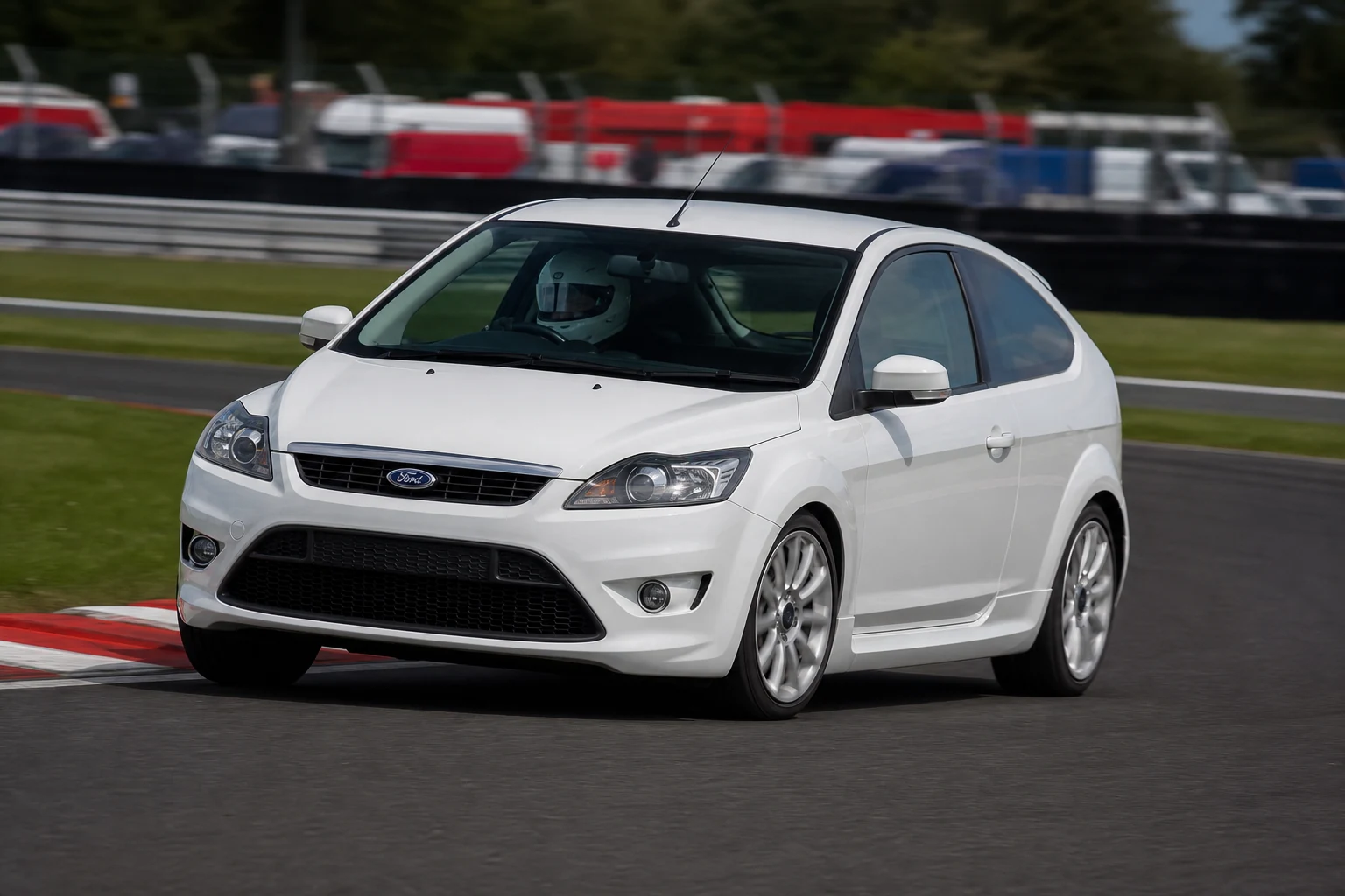 Ford Focus MK2 on track with a helmeted driver