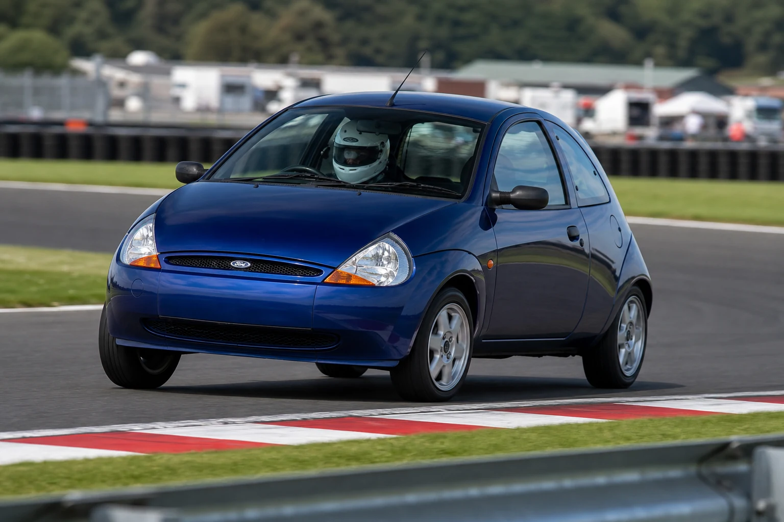 Ford KA First Gen on track with a helmeted driver
