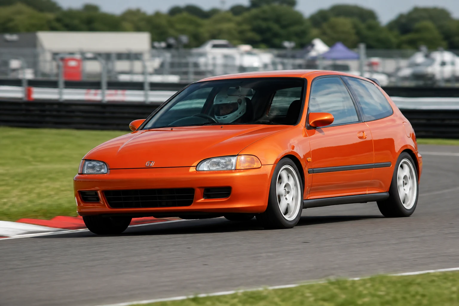 Honda Civic EG on track with a helmeted driver