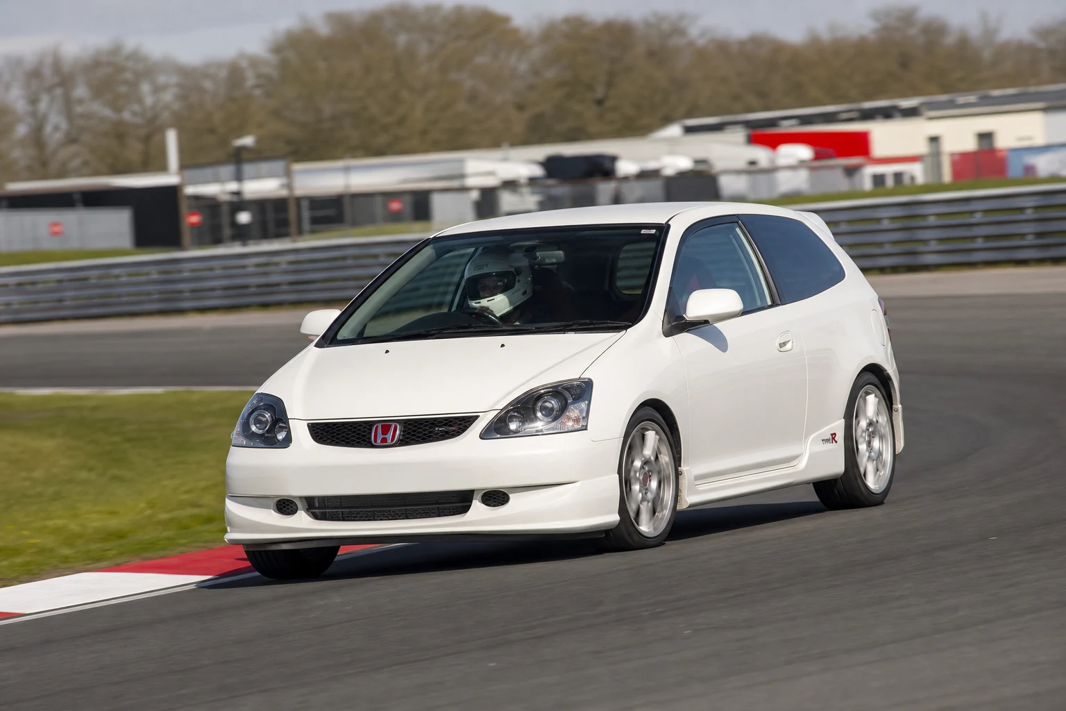 Honda Civic EP3 on track with a helmeted driver