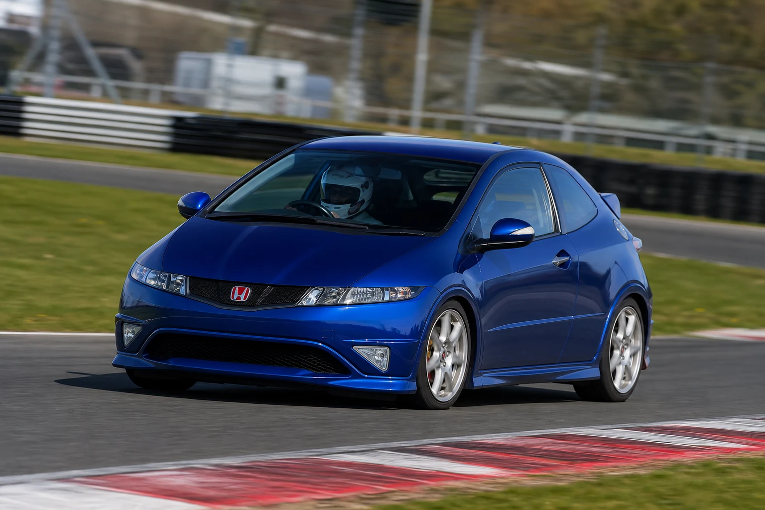 Honda Civic FN2 on track with a helmeted driver