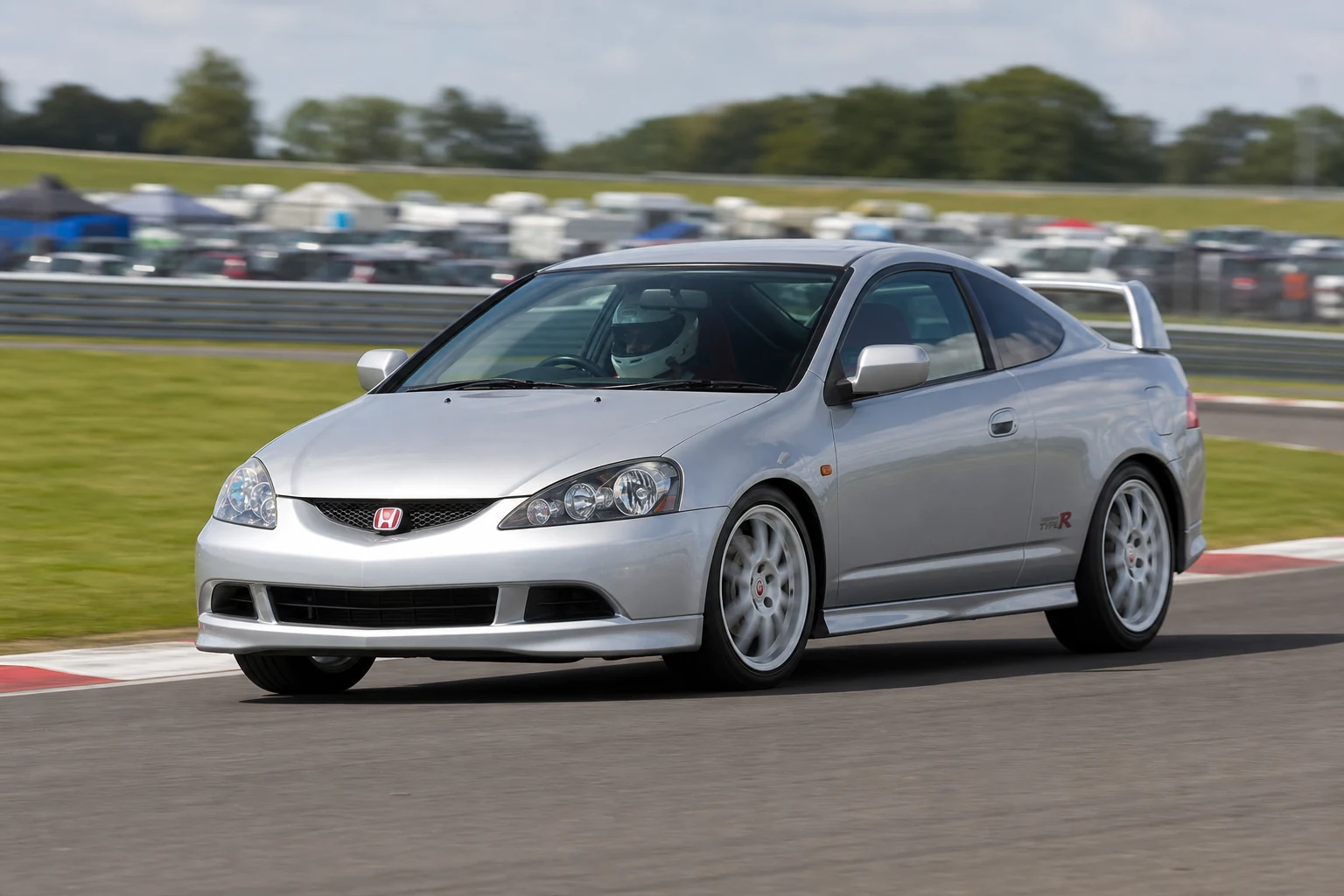 Honda Integra DC5 on track with a helmeted driver