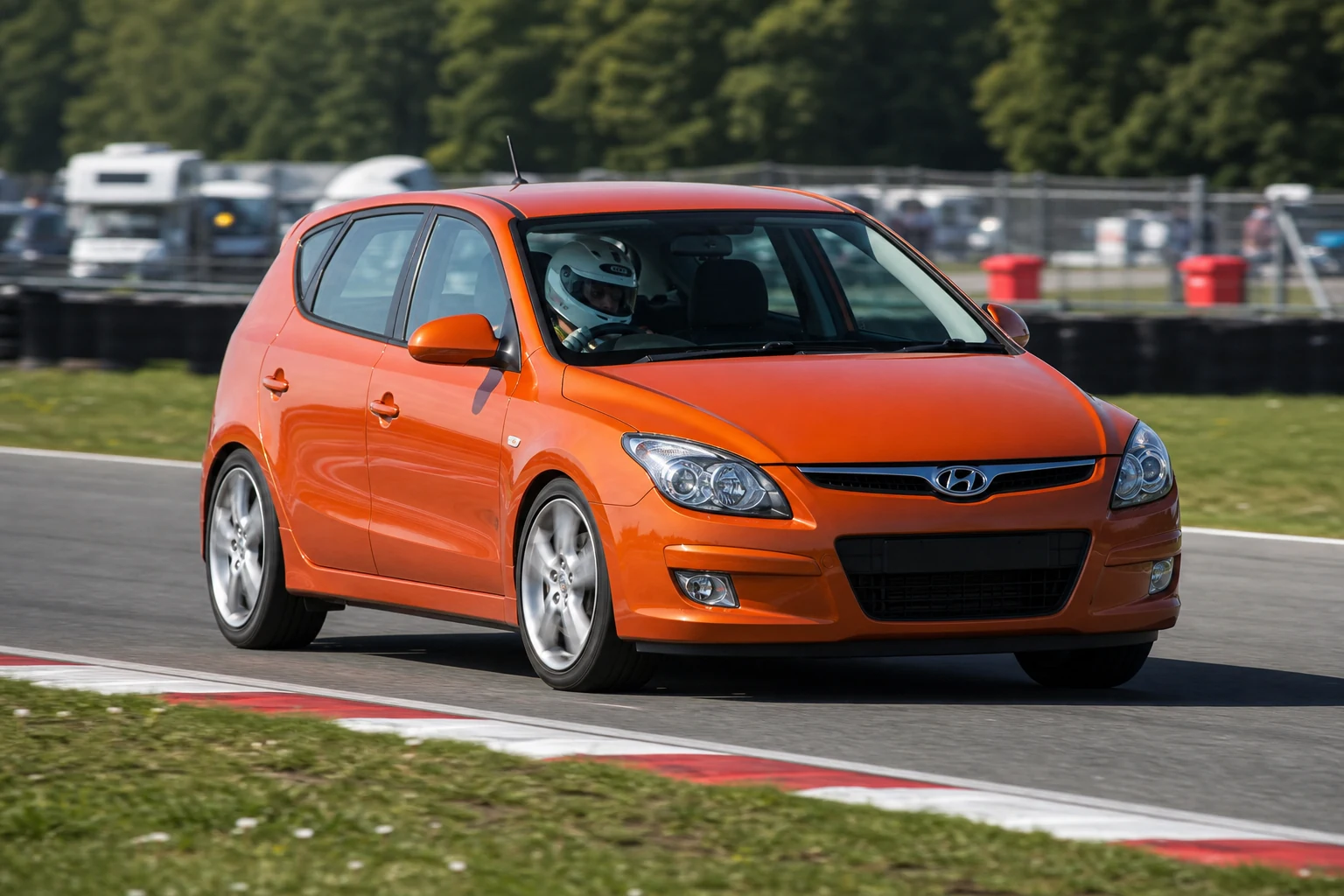 Hyundai i30 on track with a helmeted driver
