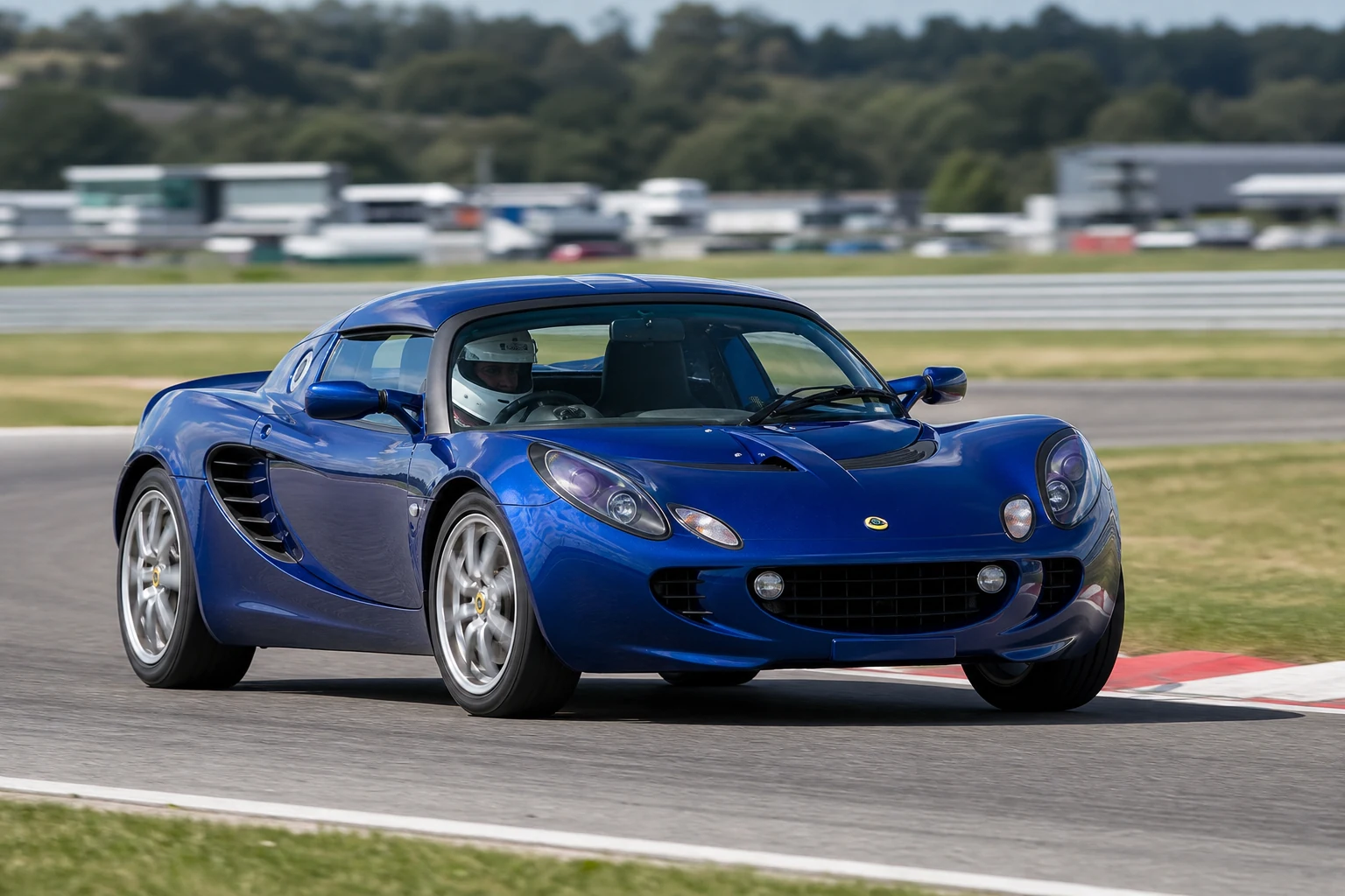 Lotus Elise S2 on track with a helmeted driver