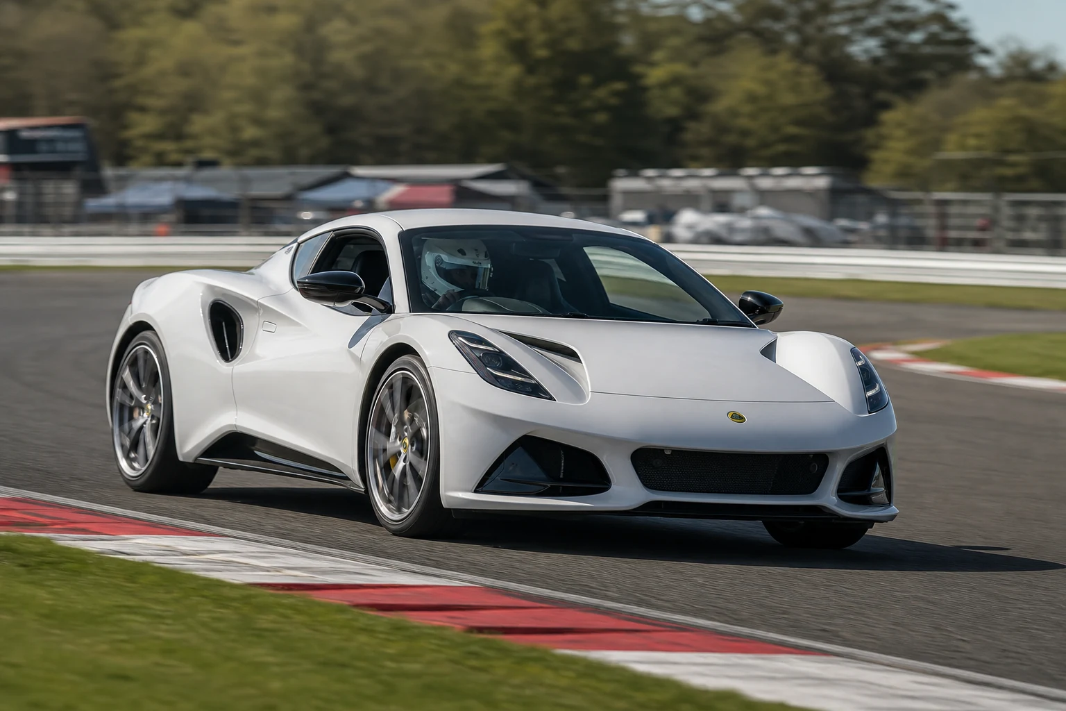 Lotus Emira on track with a helmeted driver