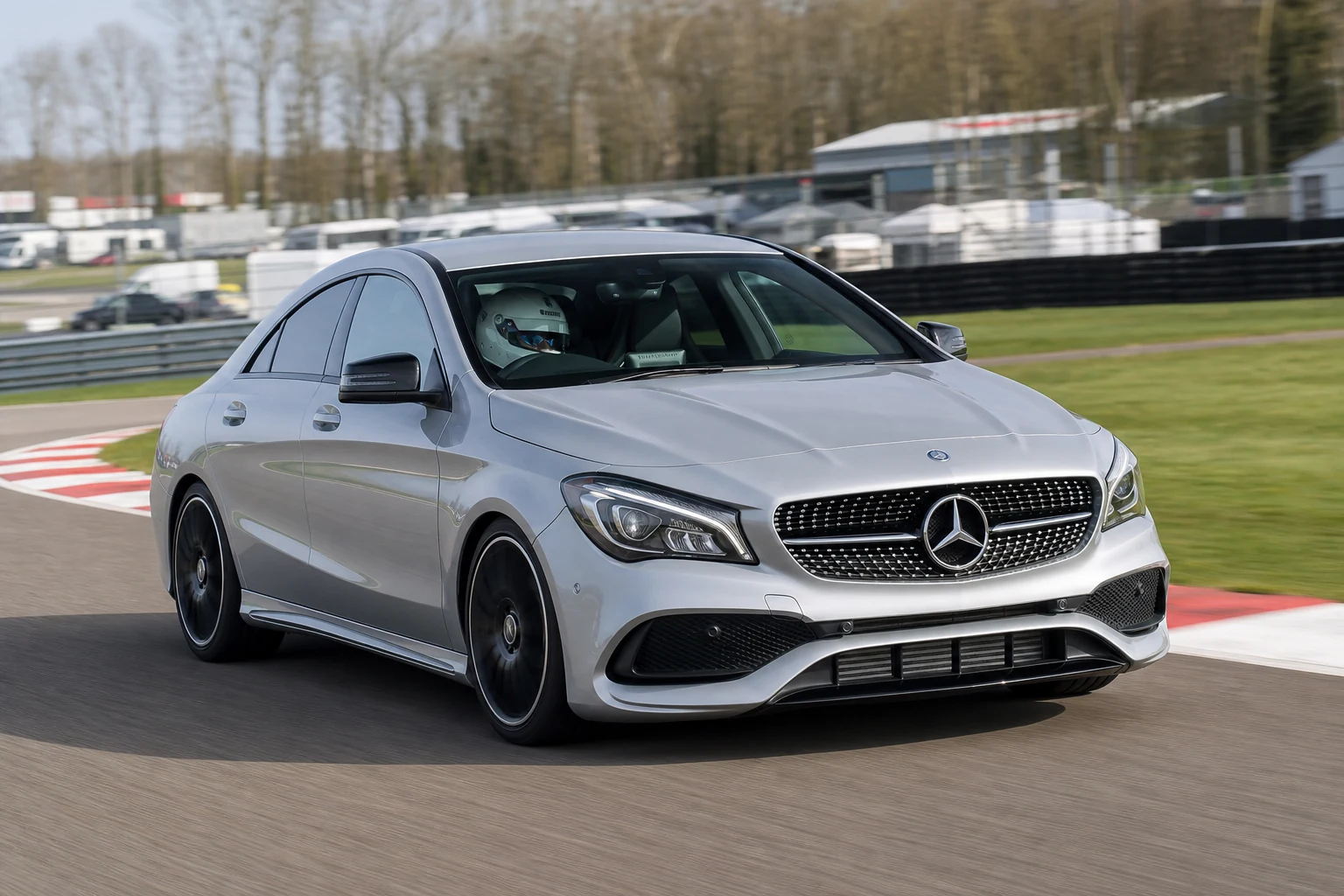 Mercedes CLA on track with a helmeted driver
