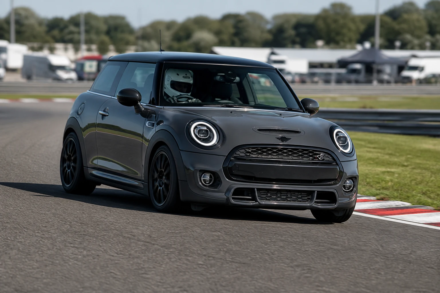 Mini F56 on track with a helmeted driver