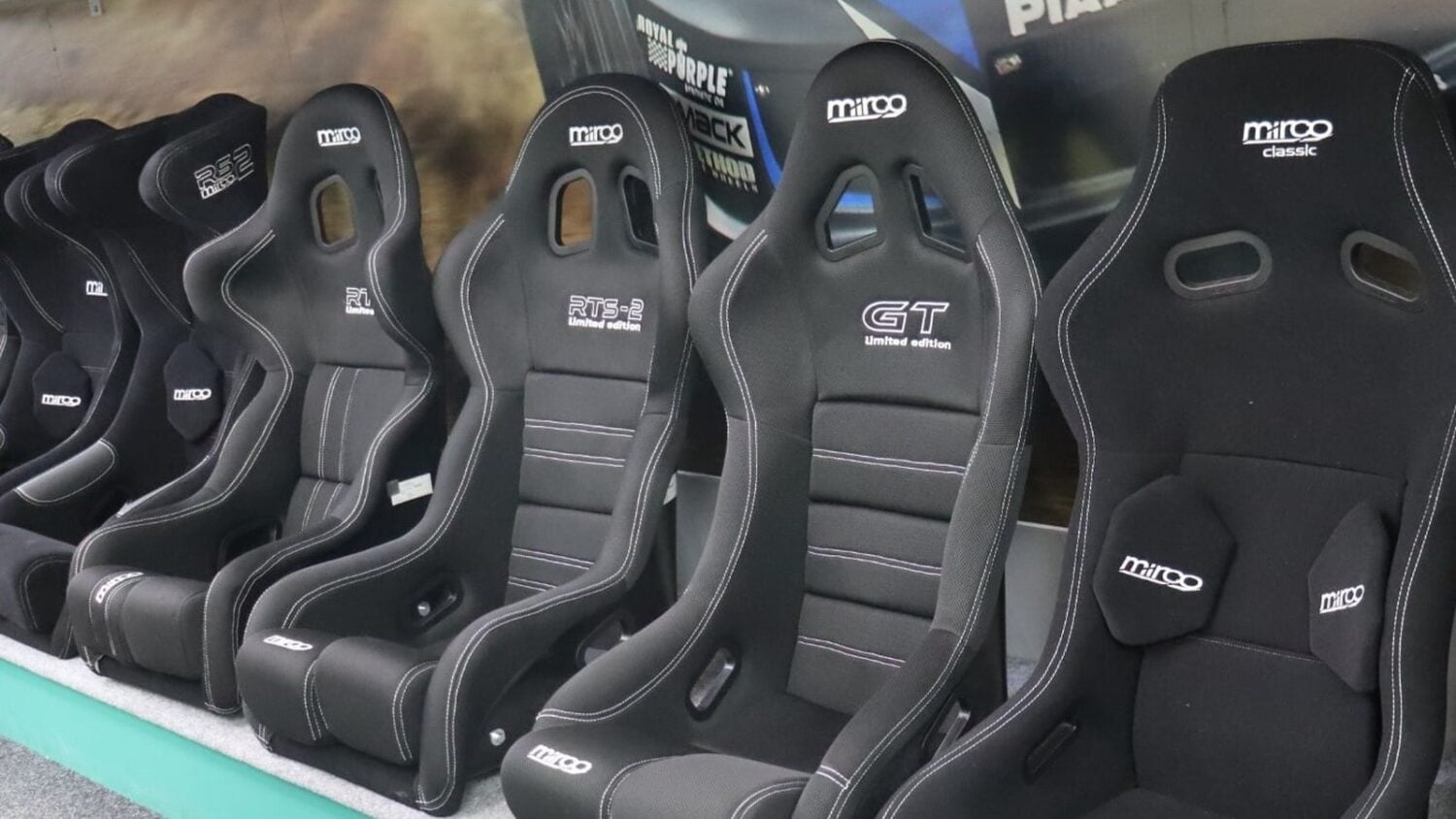 Row of Mirco bucket seats with head supports on the SportSeats4u showroom display, including the RS2, RTS-2, GT and Classic