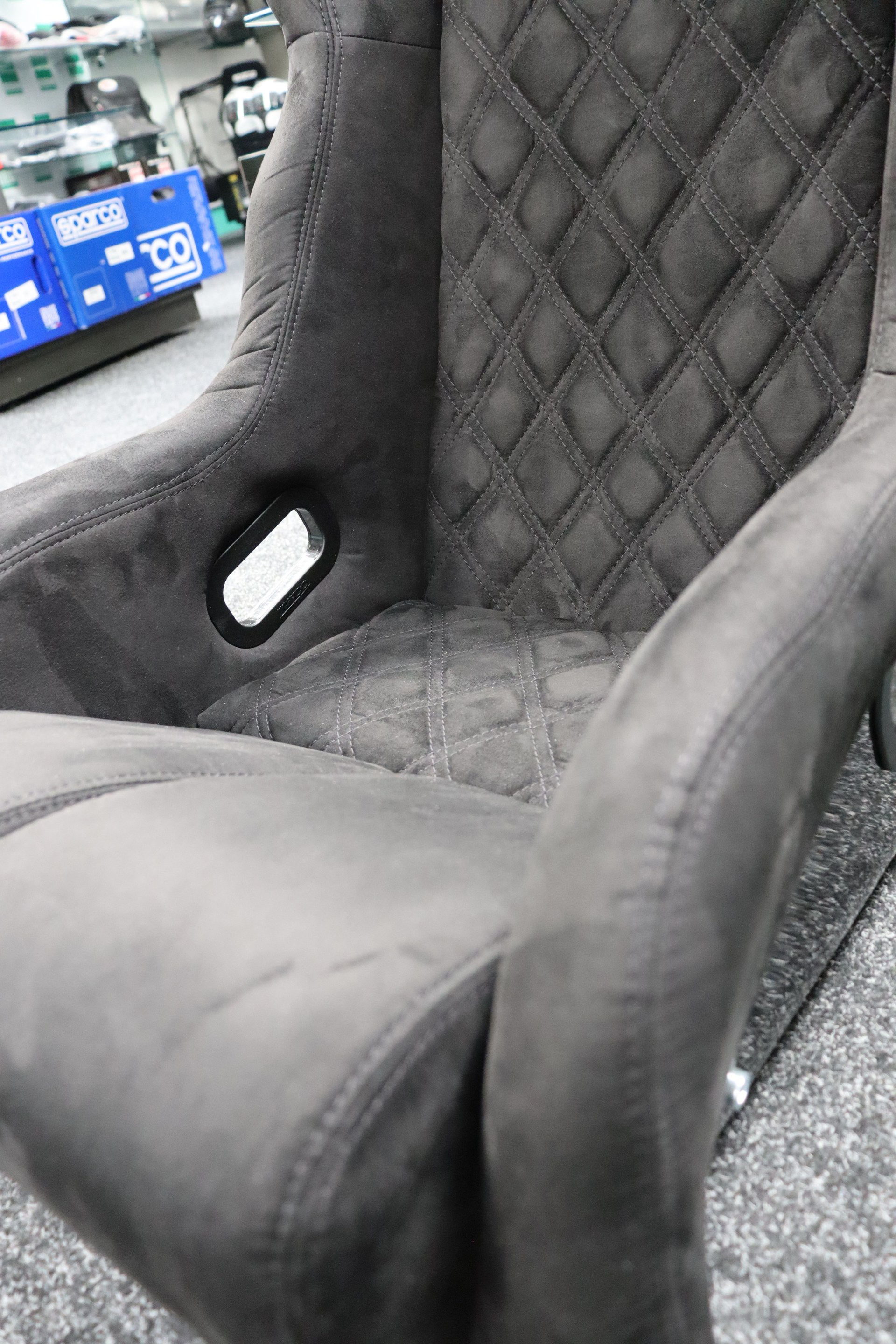 Close detail of the chrome side mount fixing point on the Mirco RTS-2 Stealth Edition shell