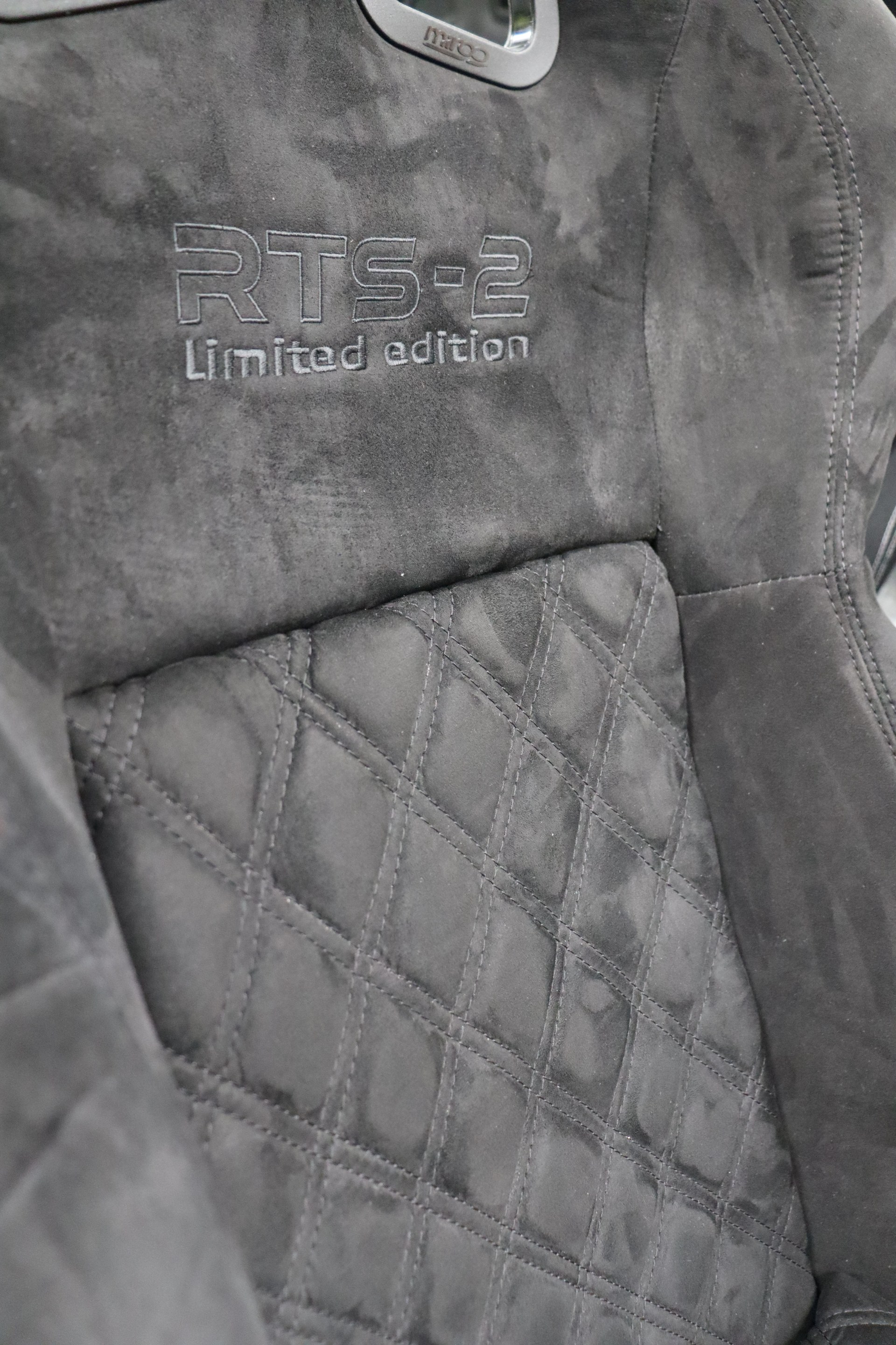 Close detail of the diamond quilted centre panel and embroidered RTS-2 Limited Edition badge