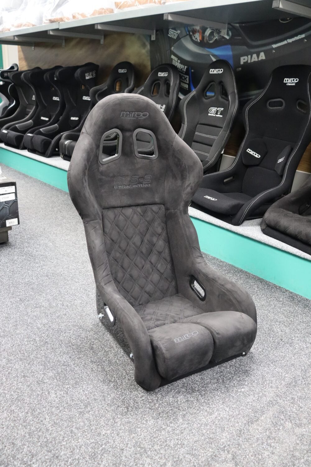 Mirco RTS-2 Stealth Edition bucket seat in faux-suede stealth trim on the GSM Performance showroom floor