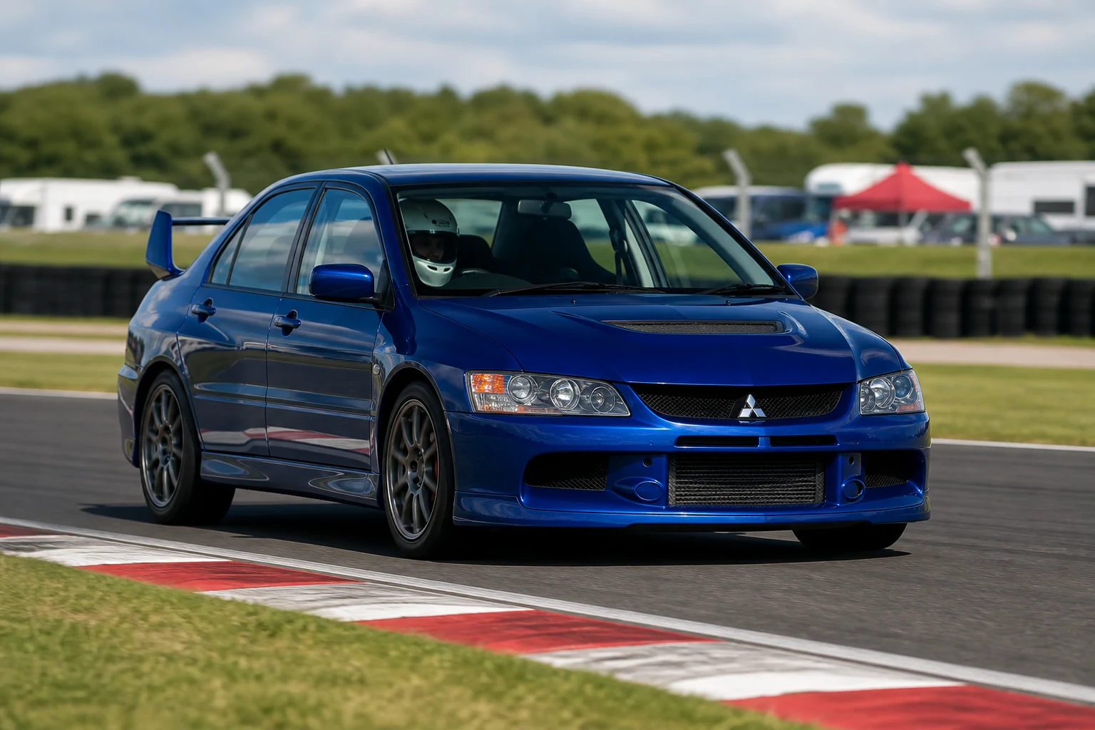 Mitsubishi Evo VII on track with a helmeted driver